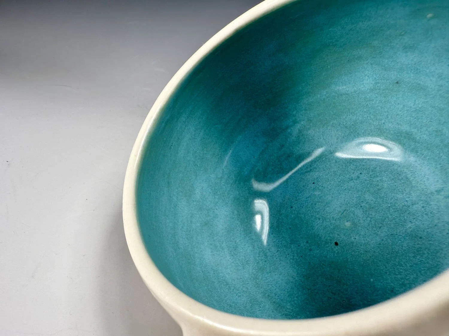 Interior view of Aqua blue lime and orange porcelain mug