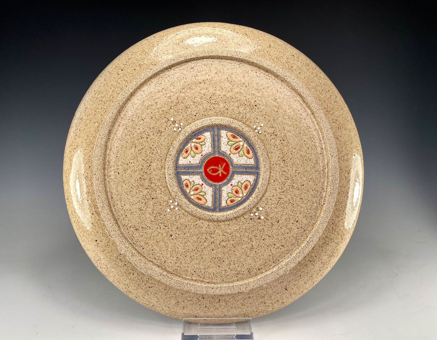 Back design on Intricately carved stoneware serving plate