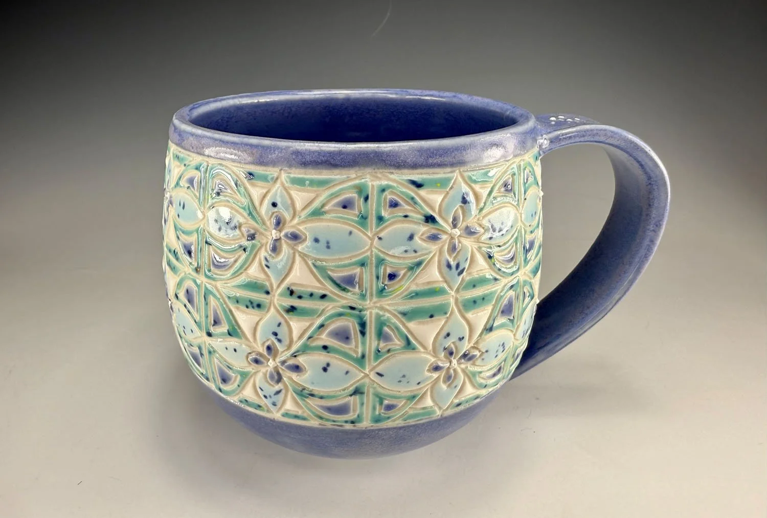 Misty blue carved porcelain mug
