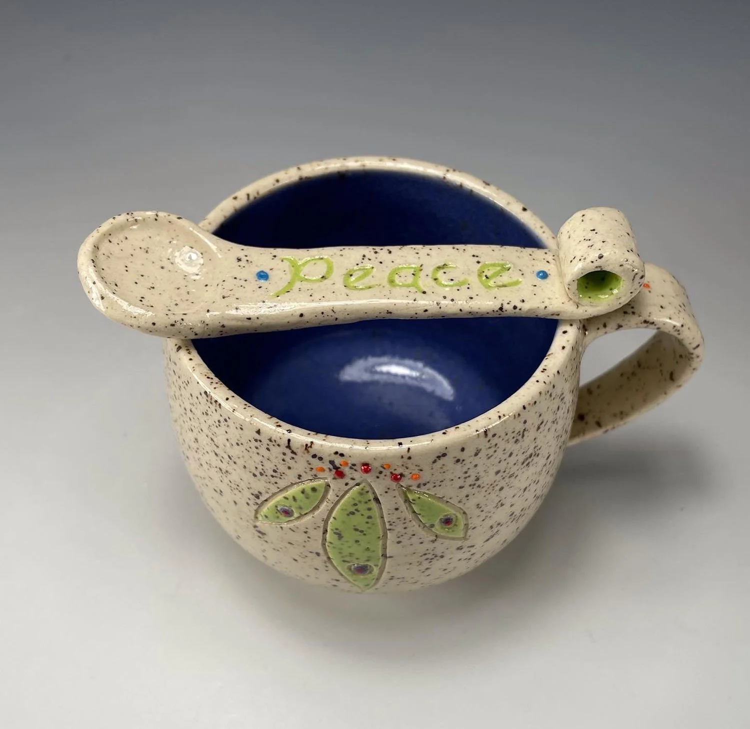 Spoon and cup of Peace cup saucer spoon stoneware set