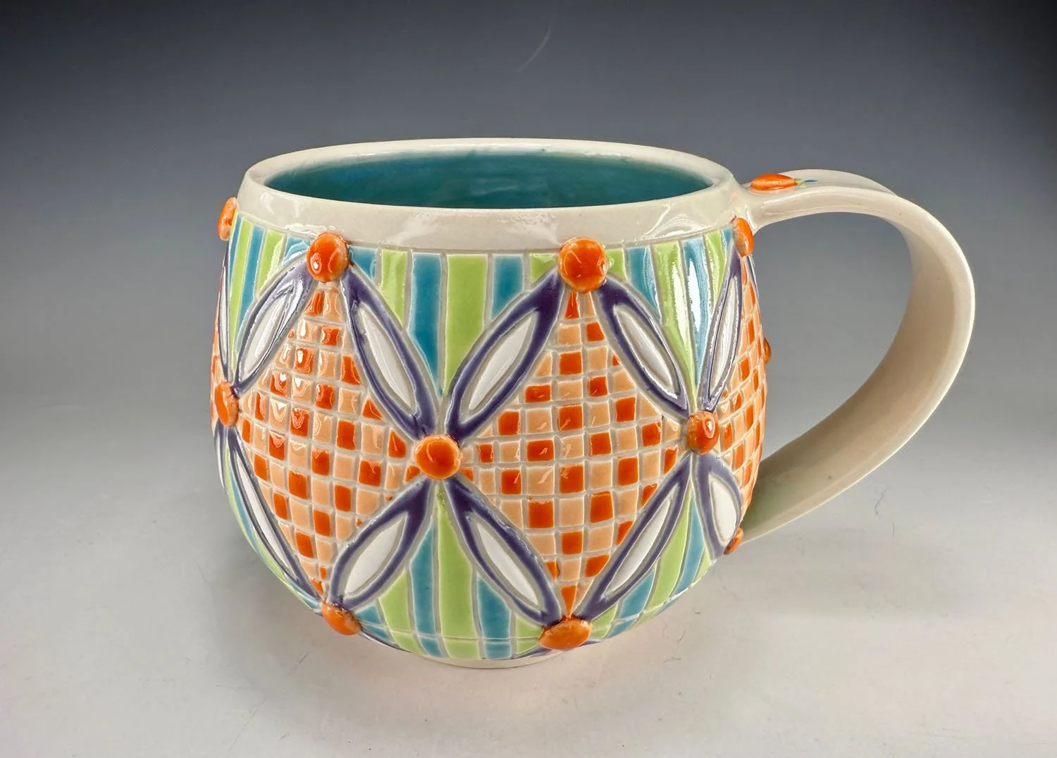 Carved checkered porcelain mug