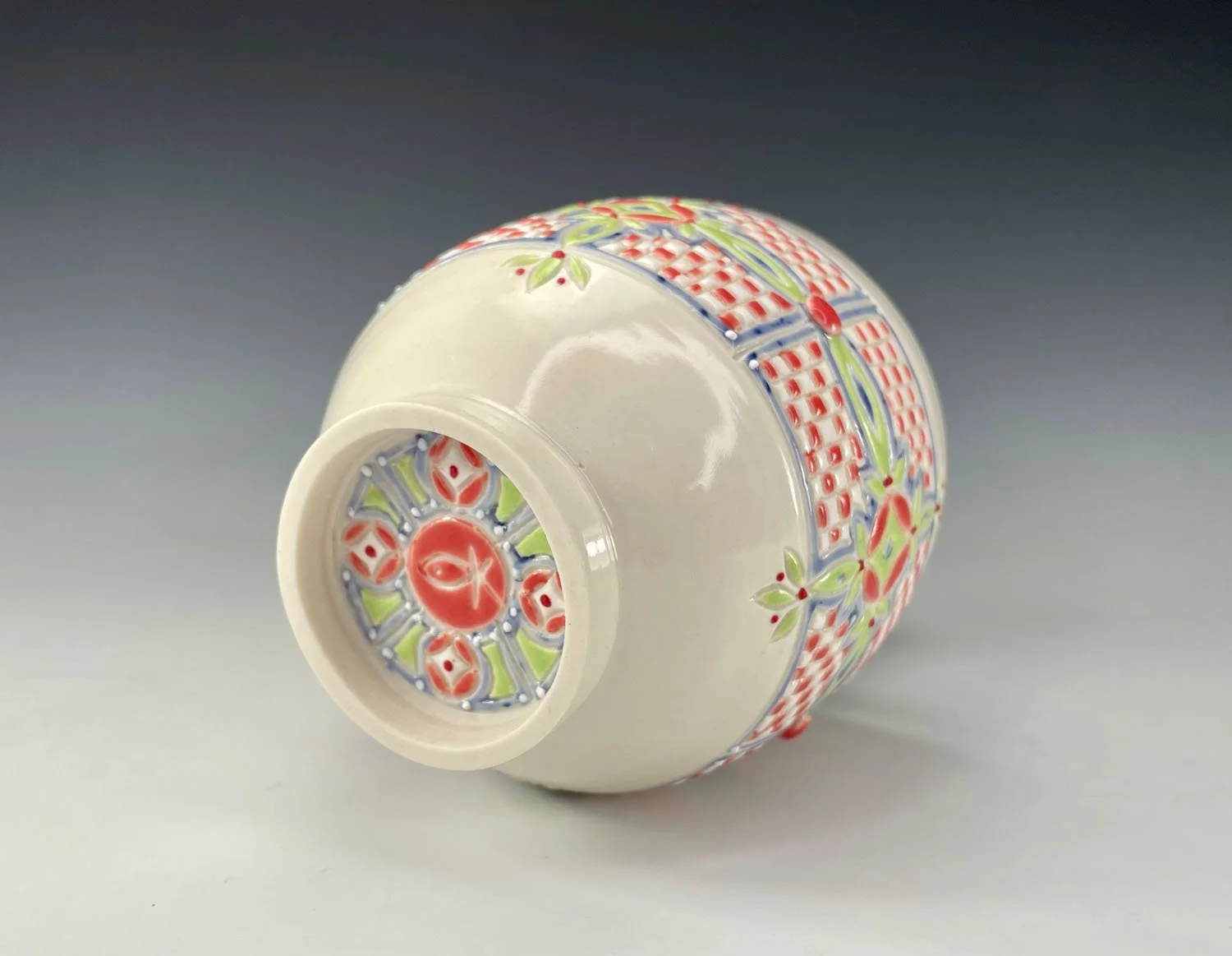 side of Twelve ounce porcelain wine cup with unique checkerboard design and periwinkle liner