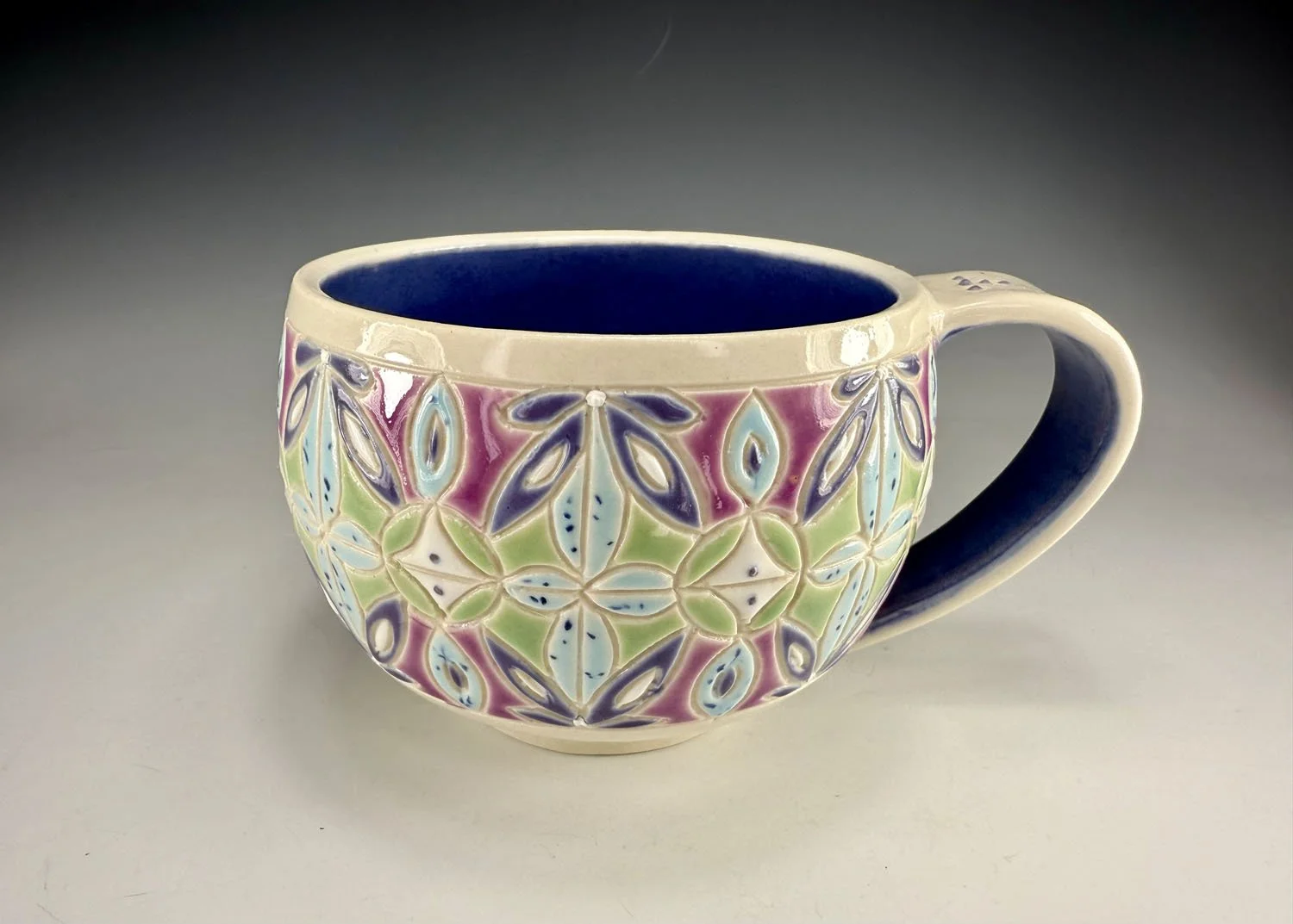 Purple blue carved porcelain mug