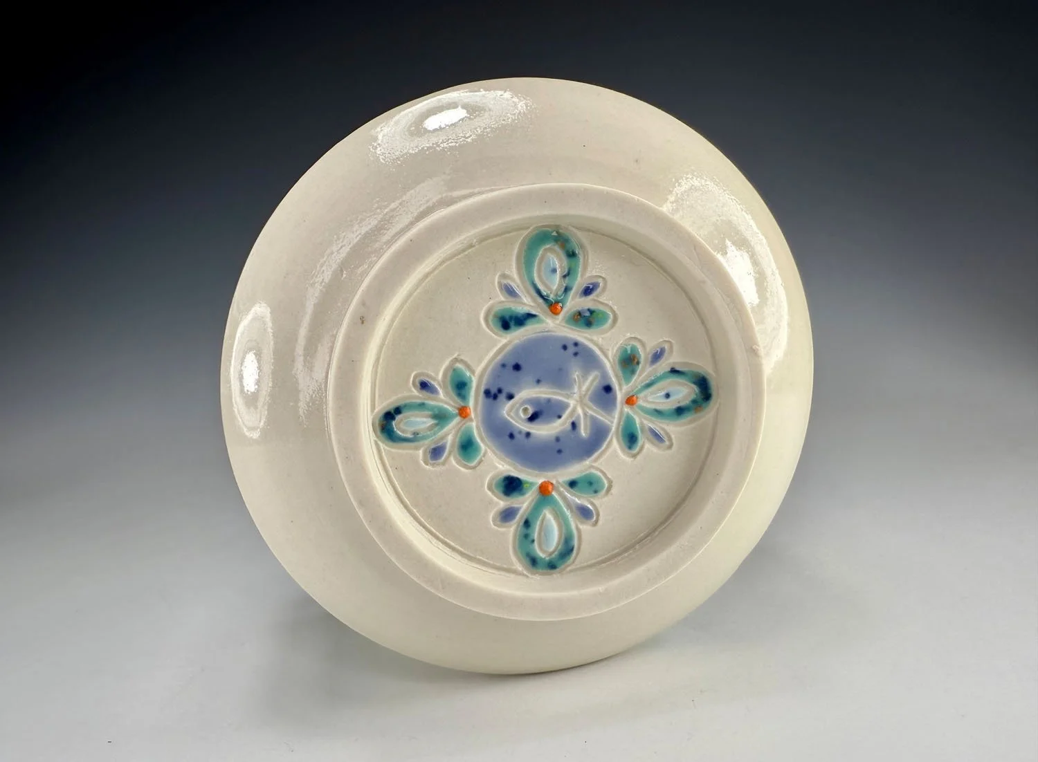 Bottom view of Porcelain carved snack bowl