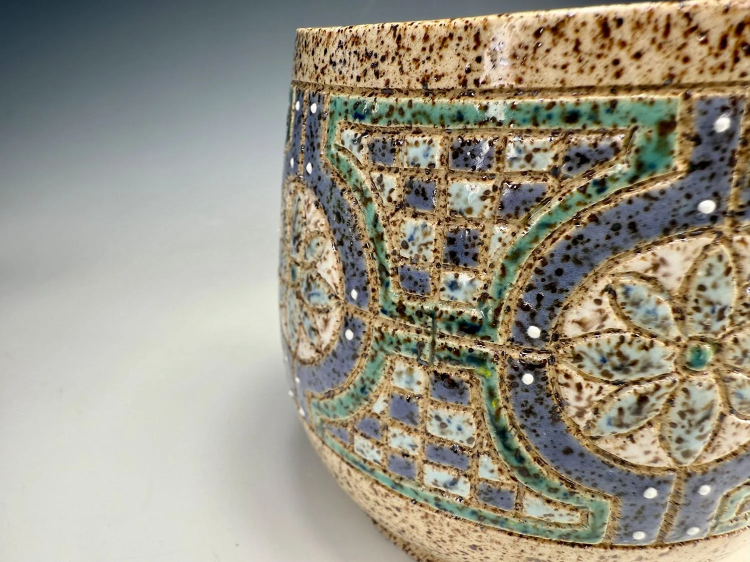Design closeup of Blue green stoneware bowl handleless mug