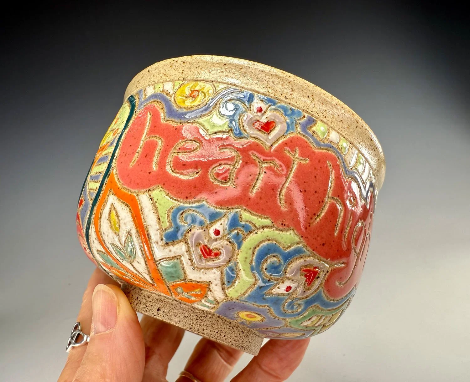 Hand holding High five stoneware bowl cup