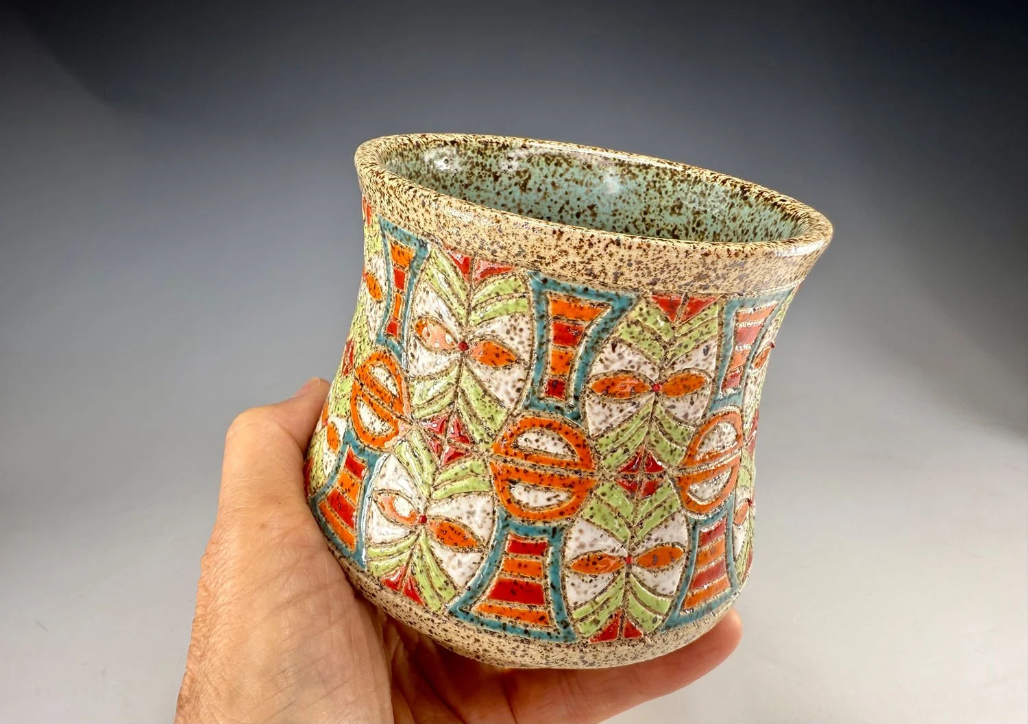 Hand holding Shields stoneware cup bowl
