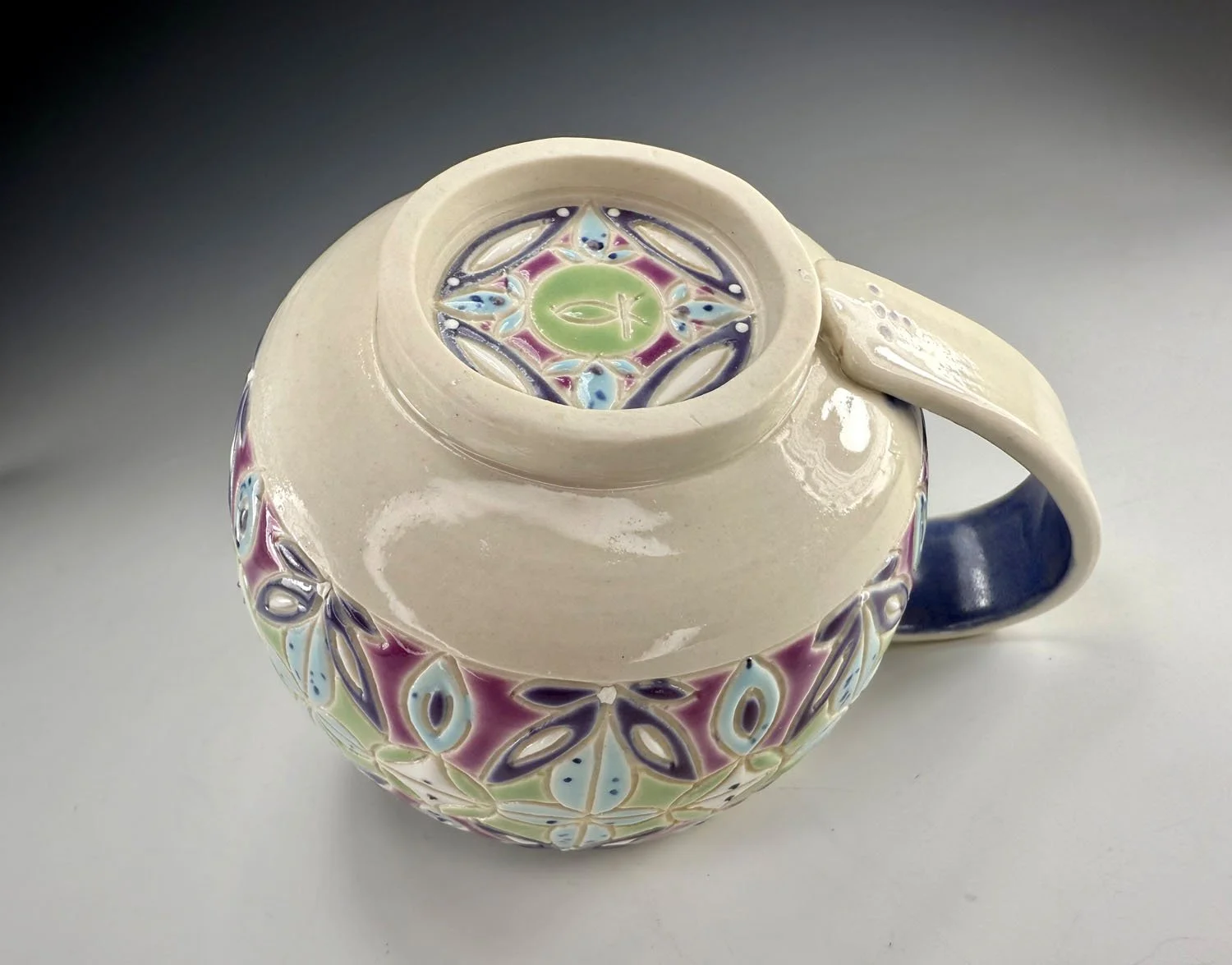 Bottom view of Purple blue carved porcelain mug