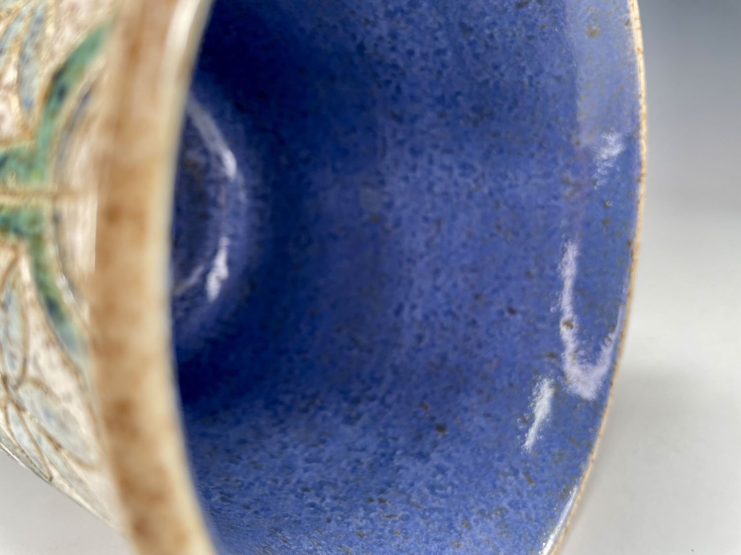 Interior view of Hand carved blue green white flowerpot utensil holder