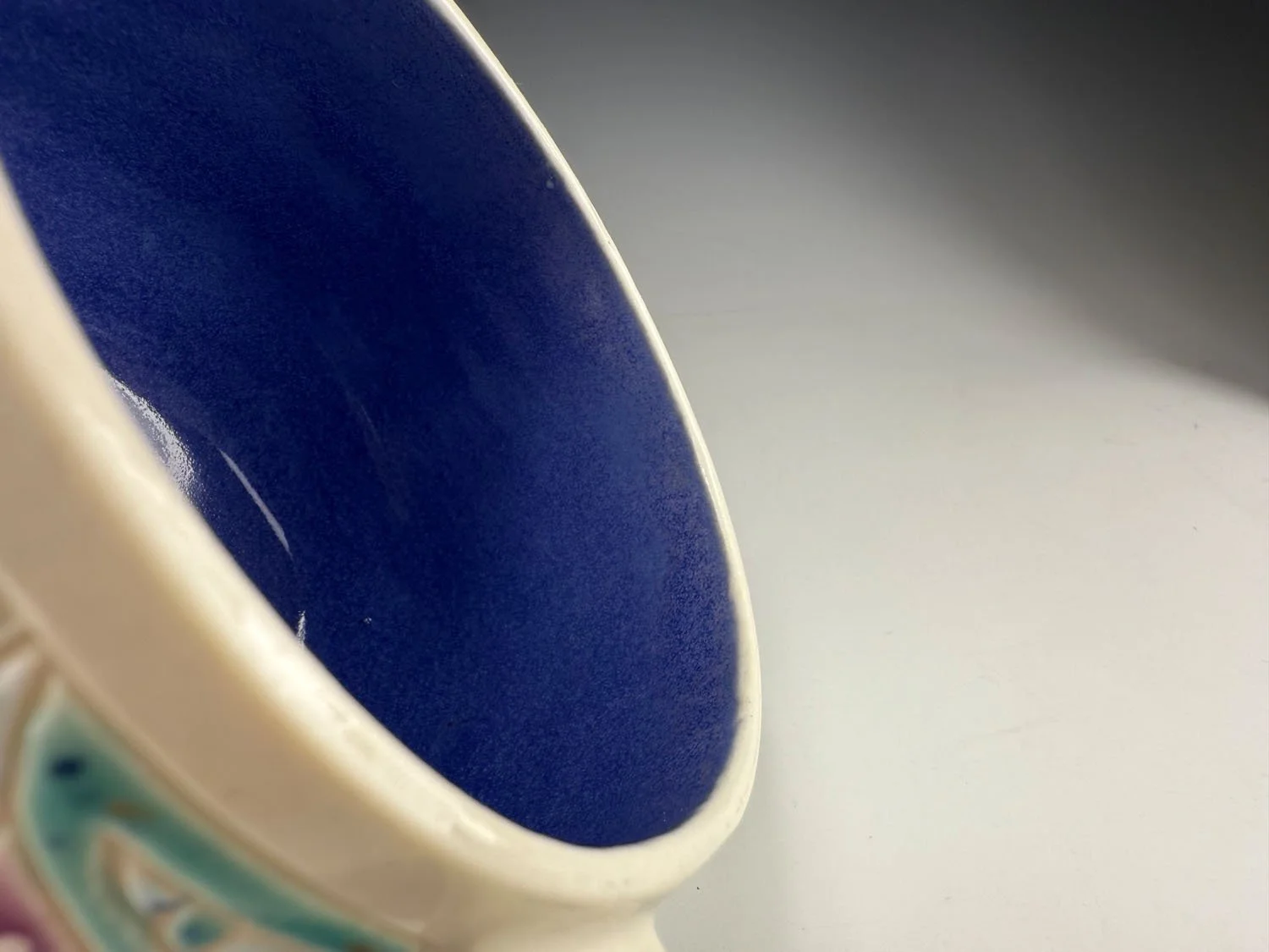 Interior blue of Blue grape carved porcelain mug