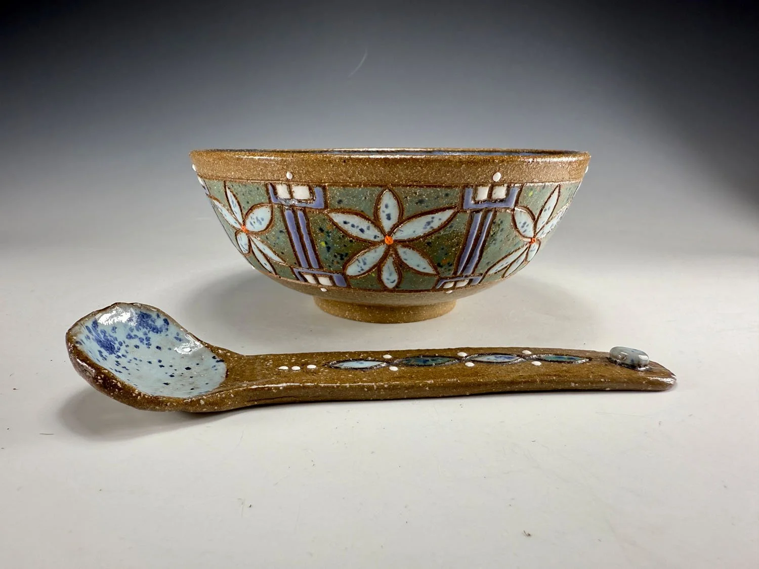 Carved bowl and spoon stoneware set