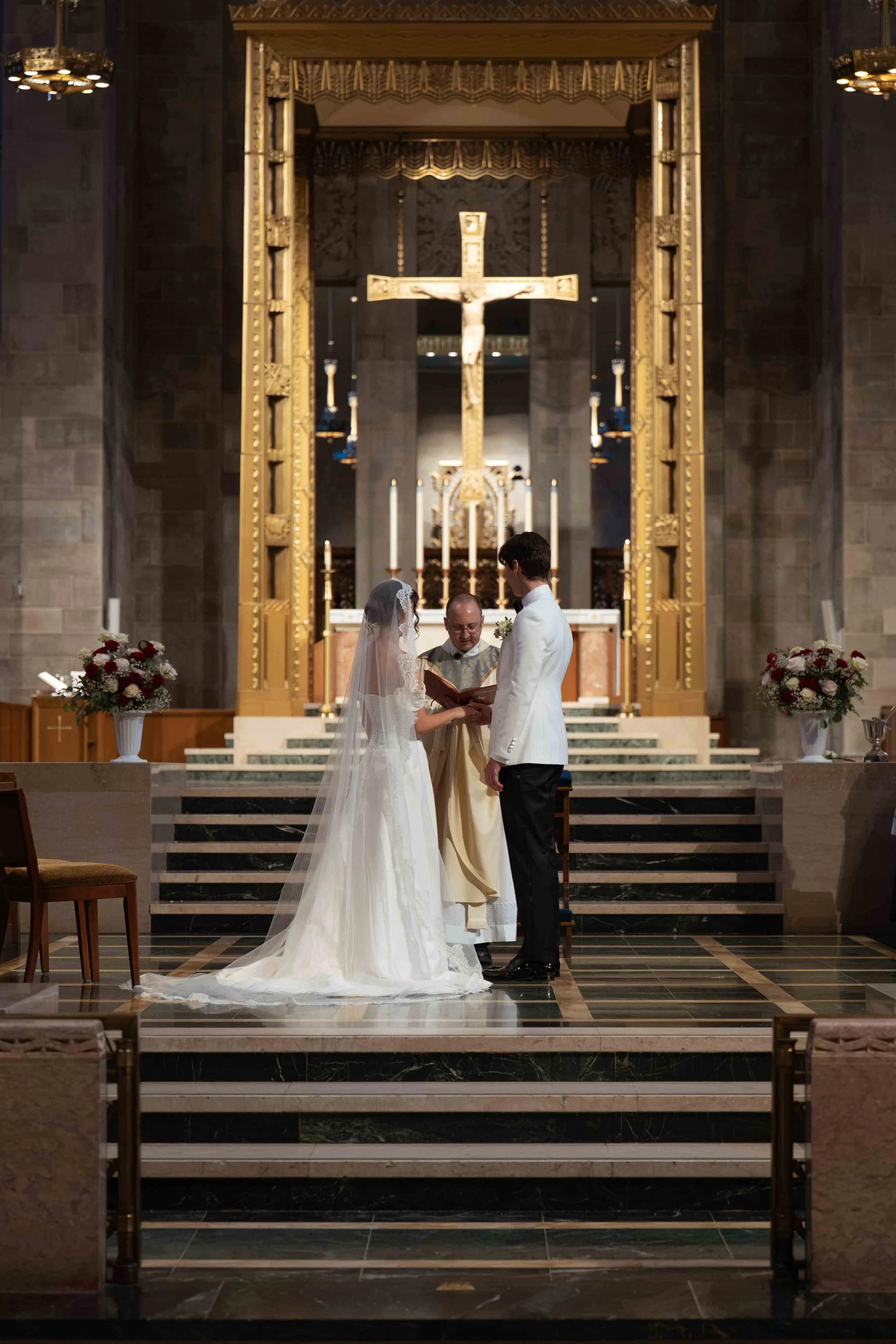 Wedding Ceremony at Mary Our Queen in Baltimore Maryland. Bride and Groom are standing reading their vows.