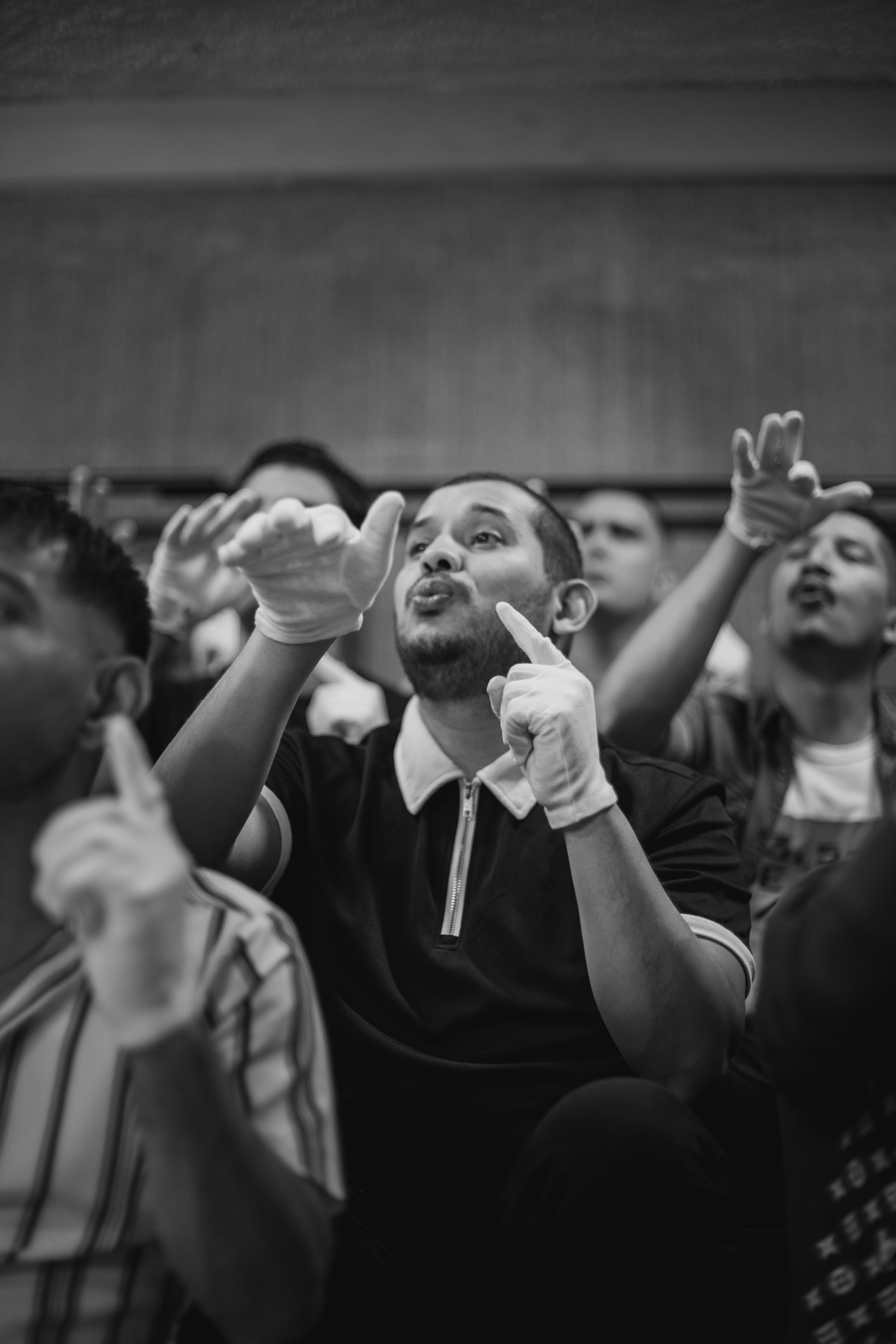 Gabriel Linarez and members of the Deaf section of the White Hands Choir (El Coro de Manos Blancas) rehearse in Barquisimeto, Venezuela. February 2024.