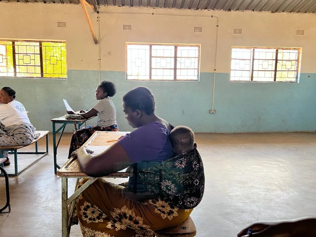 Women in school with child