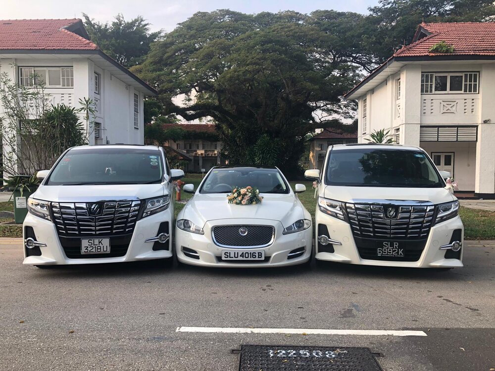 2+white+alphards+and+jaguar+Xjl+wedding+car.jpeg