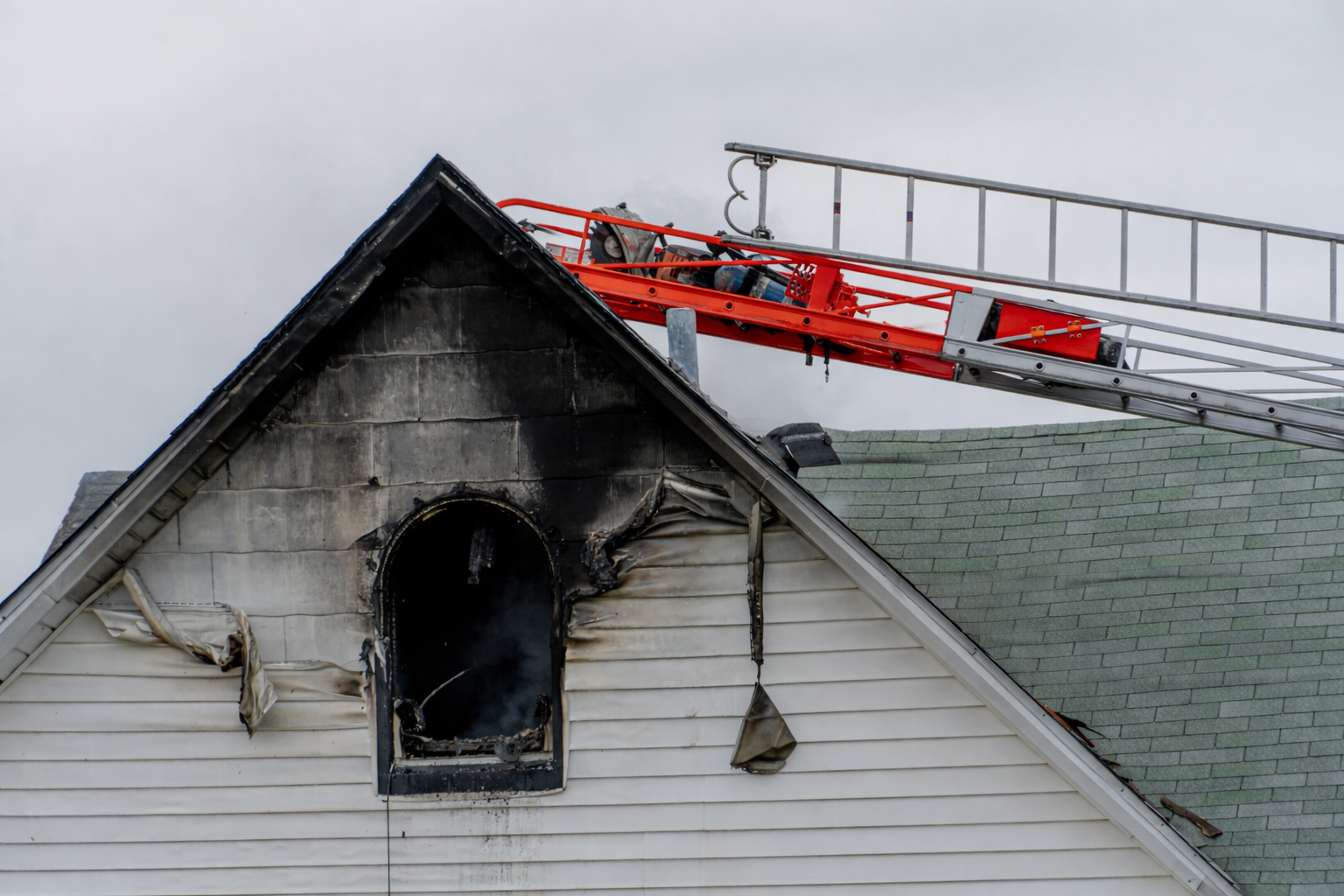 Thin, wispy trails of white smoke against a black background