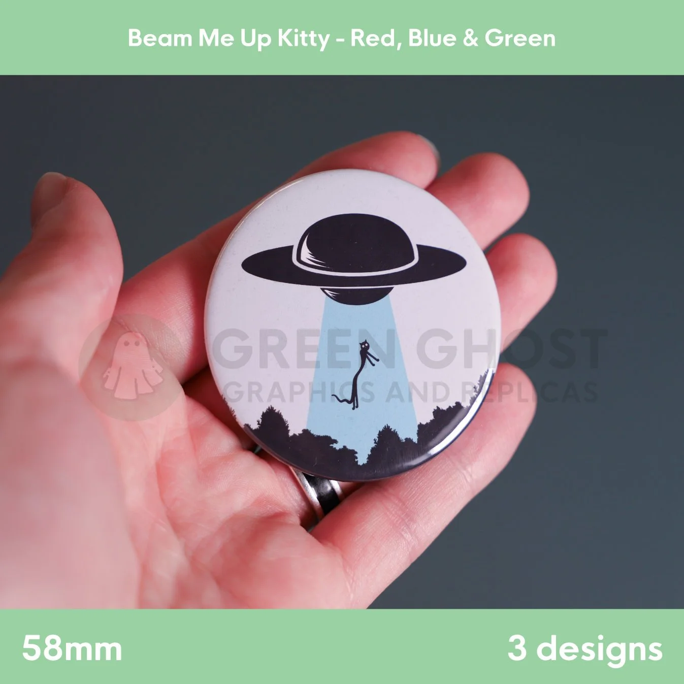 A round badge with a blue UFO beam lifting a cat held in a hand against a grey background.
