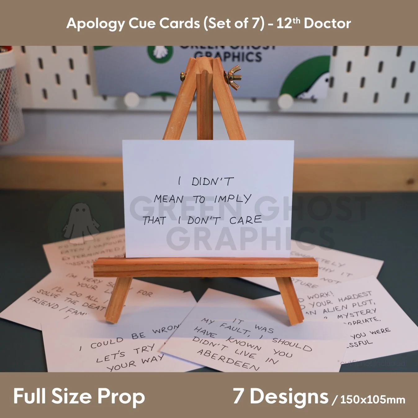 A white cue card with the text “I DIDN'T MEAN TO IMPLY THAT I DON'T CARE” shown on a wooden easel with several matching apology cards spread underneath.