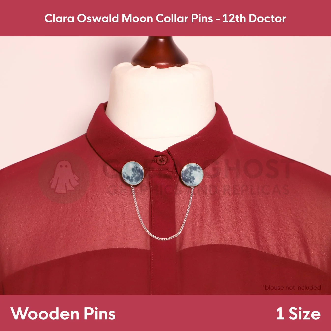 A set of round moon‑image collar pins joined by a silver chain displayed on a mannequin in a deep red shirt.
