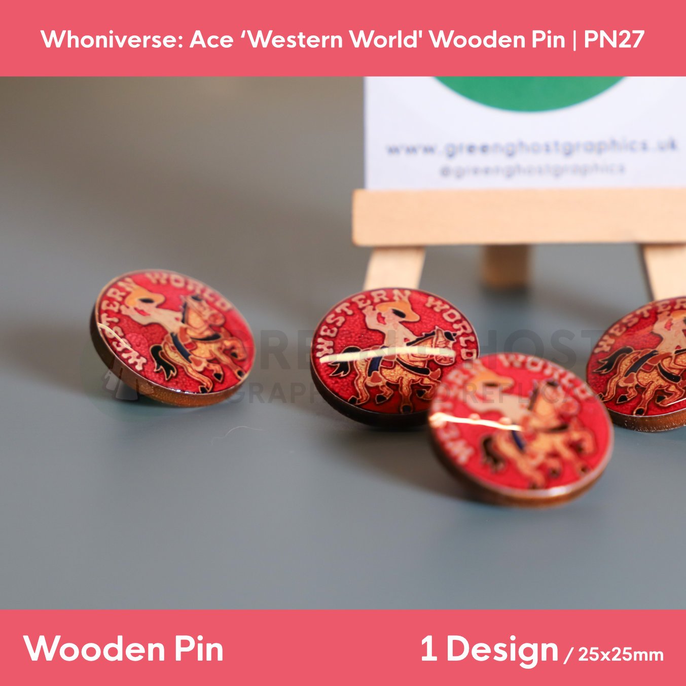 Several circular wooden “WESTERN WORLD” pins displayed on a flat surface, with one pin standing upright and a branded backing card on a wooden easel in the background.