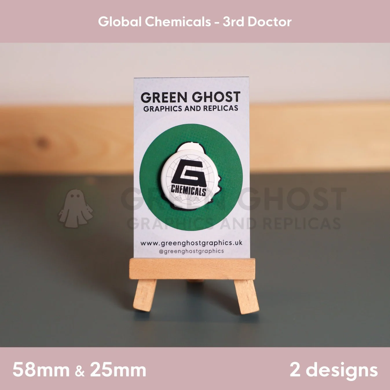 A round white badge with the “G CHEMICALS” logo and globe motif mounted on a branded card on a wooden easel.