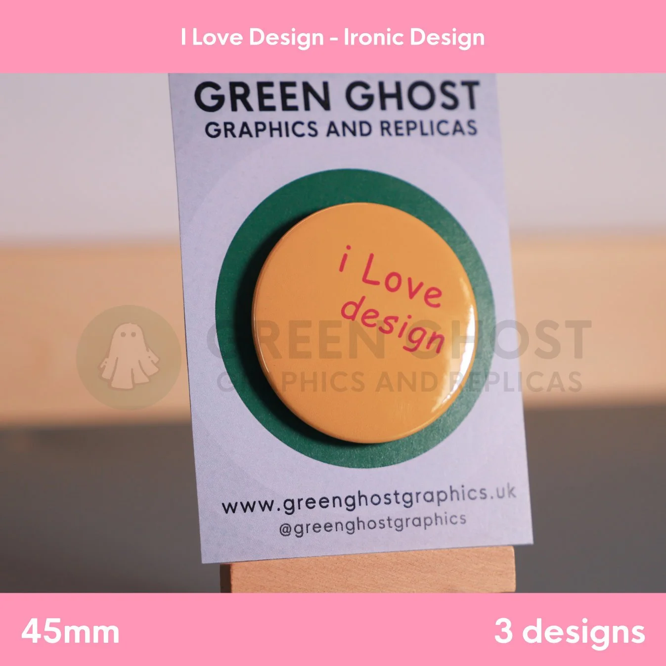 A circular orange badge with red “i Love design” text attached to a branded display card.