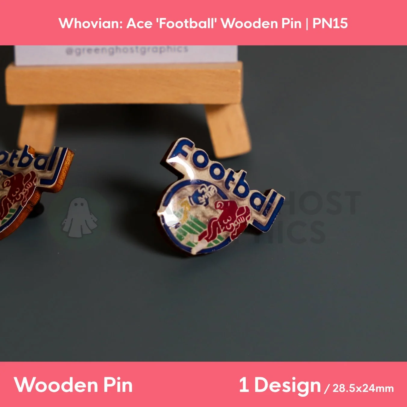 A wooden pin with blue “Football” text above a red, blue, green, and yellow football graphic shown in front of a wooden display stand.