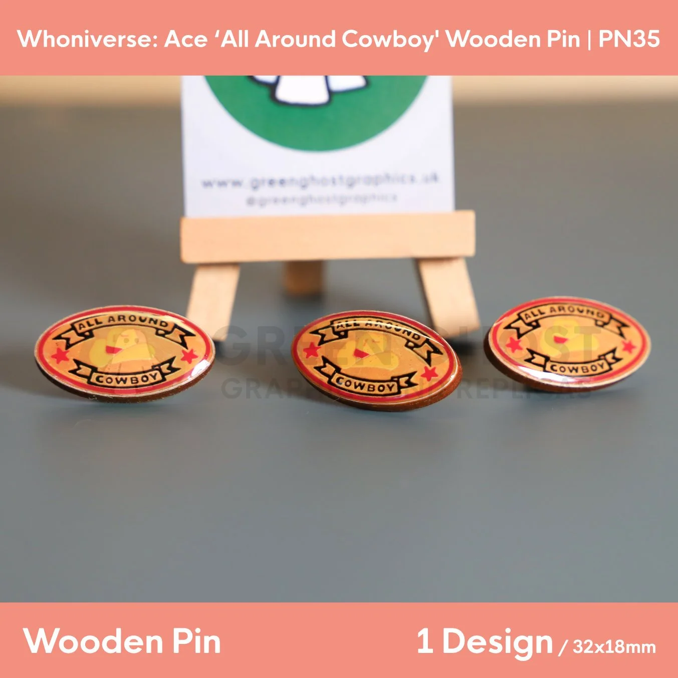 A close up of the oval “ALL AROUND COWBOY” wooden pin with black text, red and yellow detail surrounded by other identical pins.