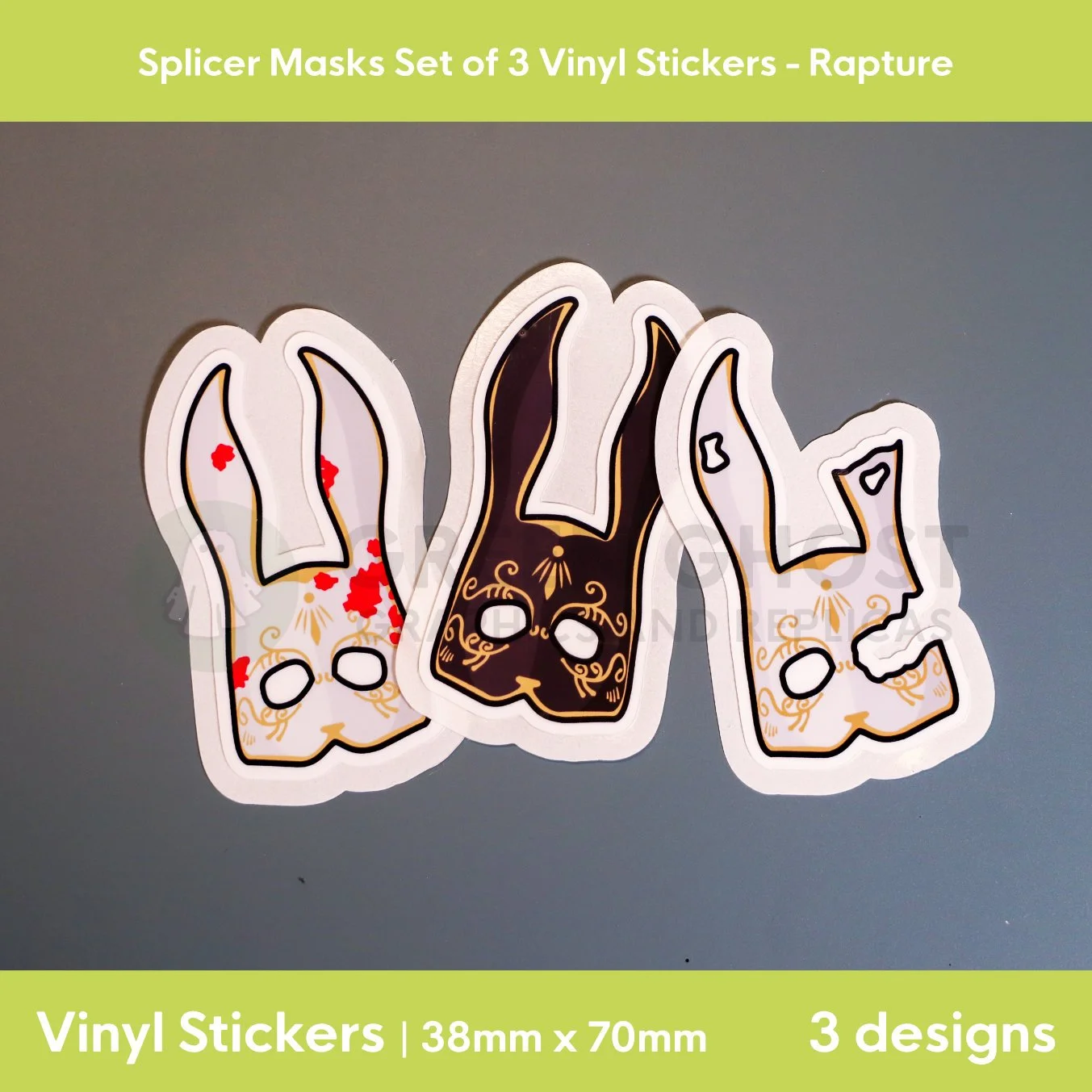 Vinyl sticker set with the design of a black, white and broken white aged rabbit masks with gold detailing. On a aqua green background.