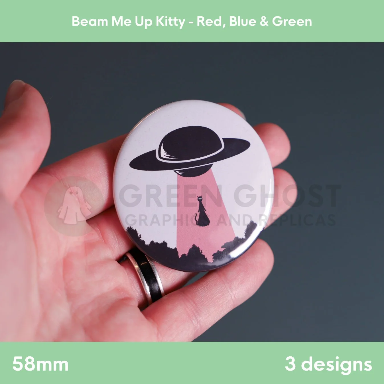 A round badge with a red UFO beam lifting a cat held in a hand against a grey background.