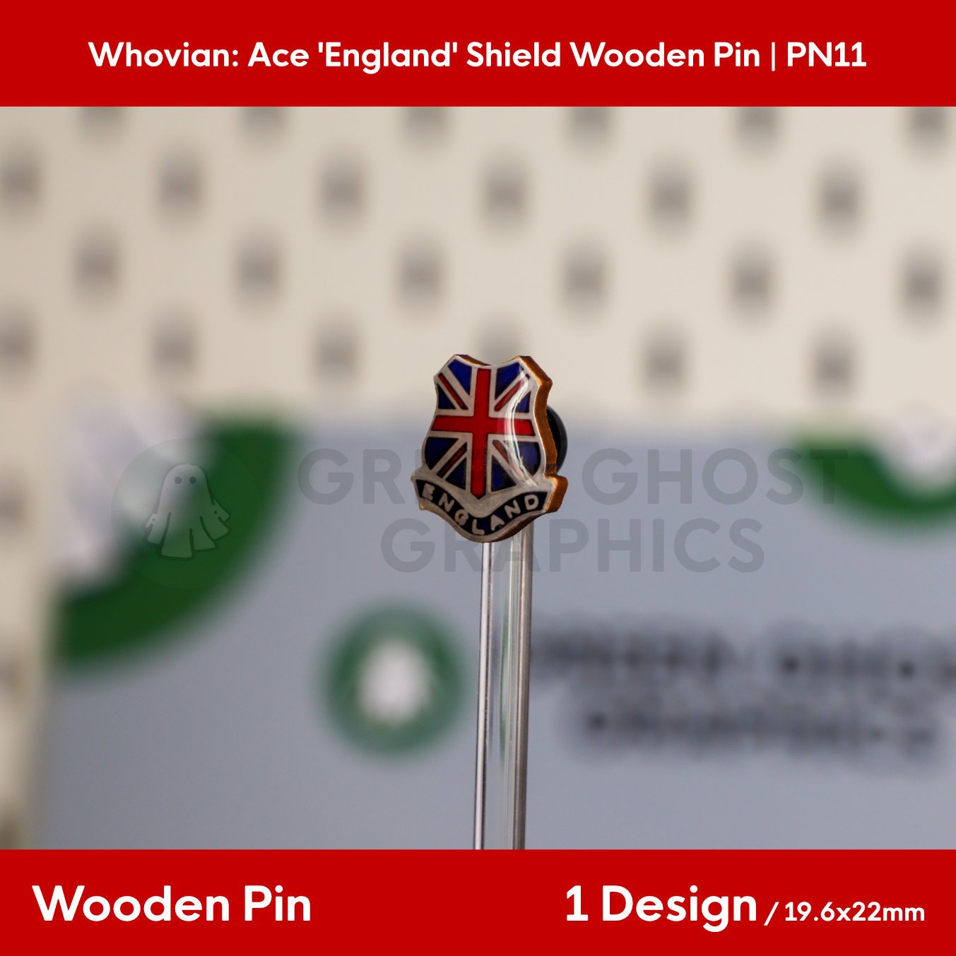 A wooden shield pin with a Union Jack pattern and the word “ENGLAND” shown from an angle on a transparent display rod.