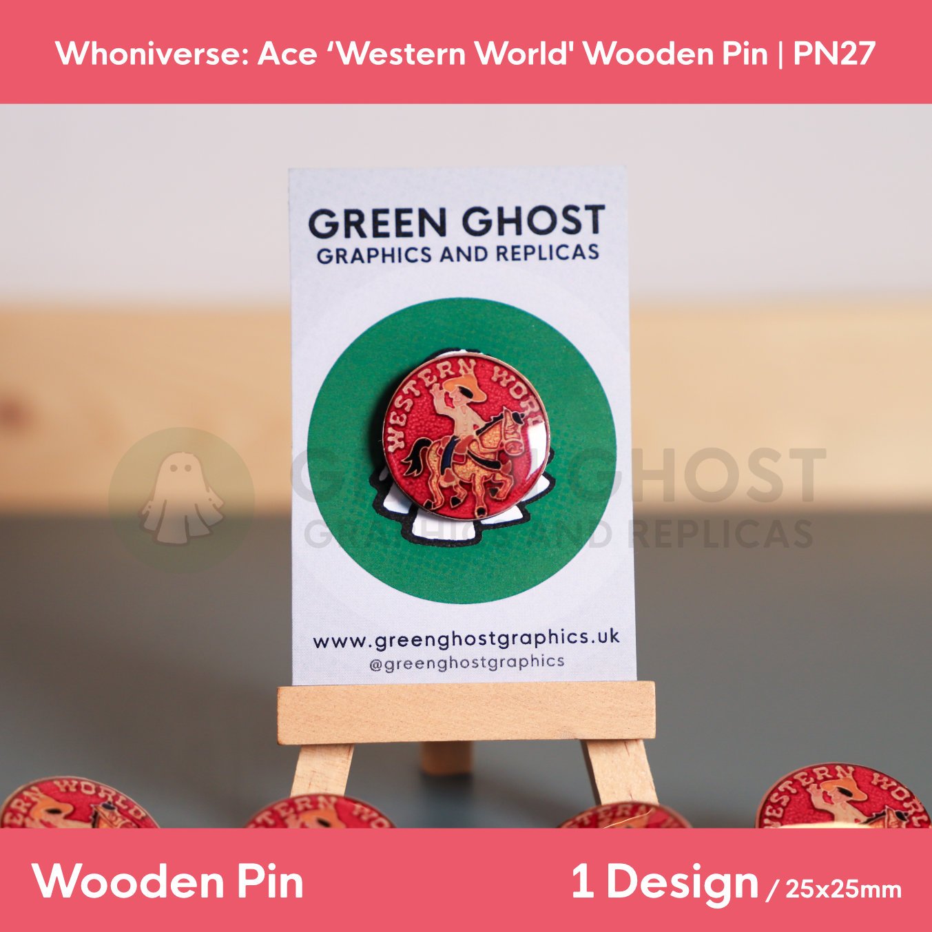 A red circular “WESTERN WORLD” wooden pin mounted on a branded backing card on a wooden easel, with additional pins partially visible at the bottom of the frame.