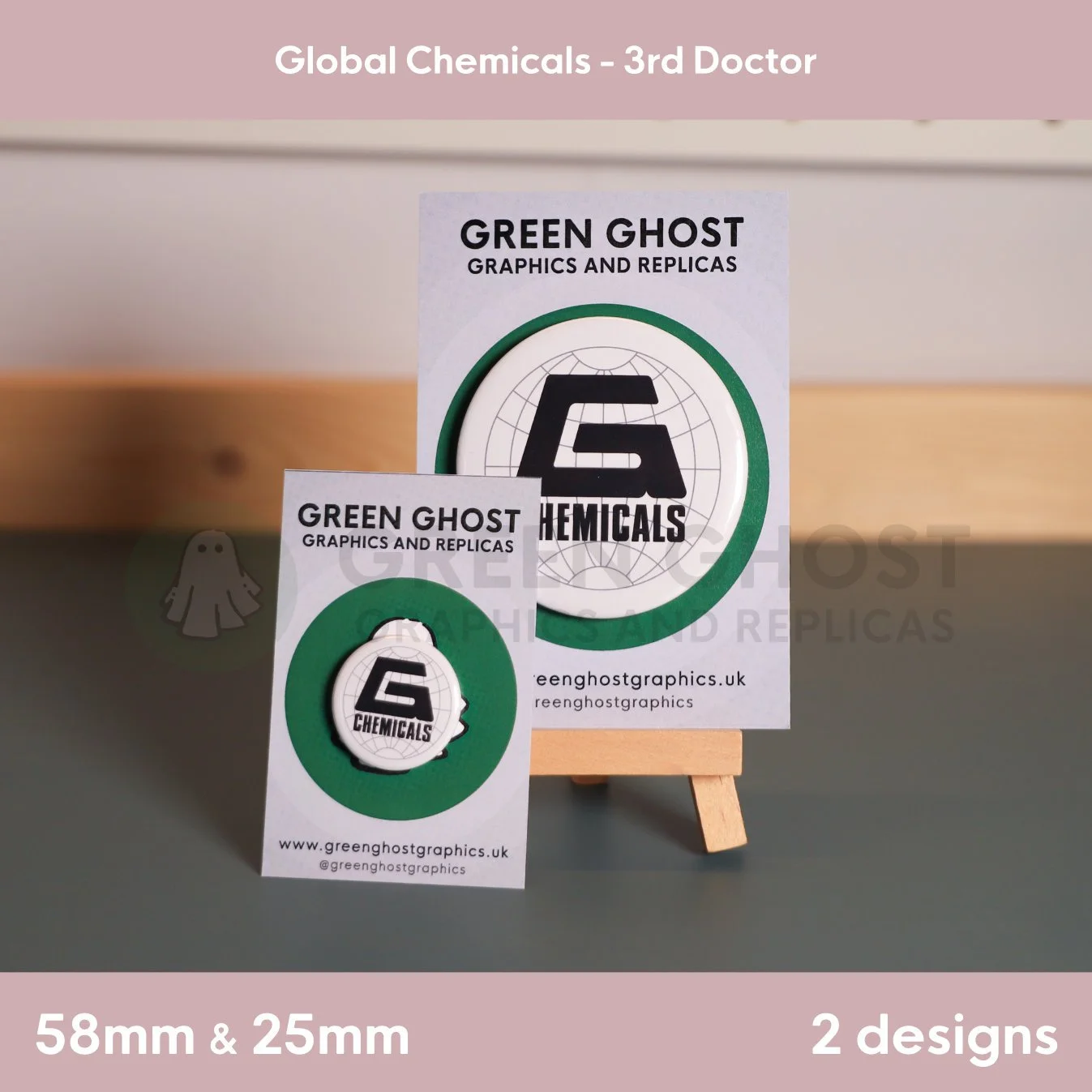 A large round white badge with a green border and “G CHEMICALS” text shown on a wooden easel with a smaller matching badge in front.