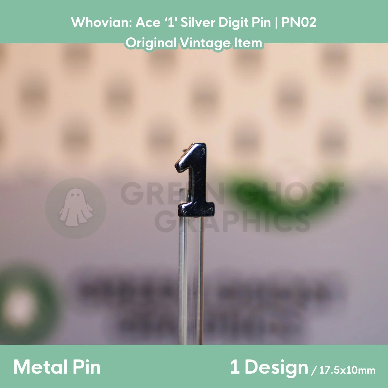 A metallic silver digit “1” pin shown from a slight angle on a transparent display rod against a blurred background.