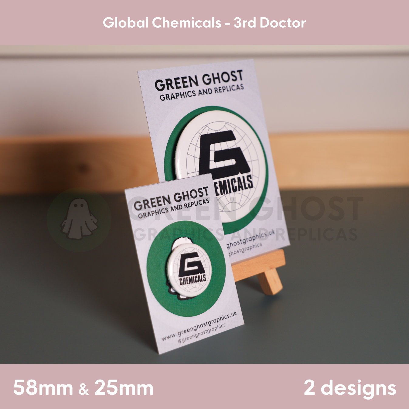 A pair of round white badges featuring the “G CHEMICALS” logo displayed on branded cards with one mounted on a wooden easel.