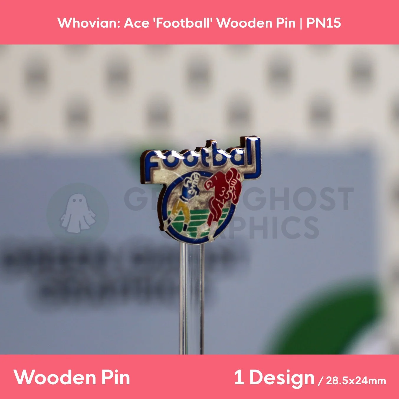 The back of a football‑themed wooden pin with a natural wood finish and black rubber clasp displayed on a clear stand.