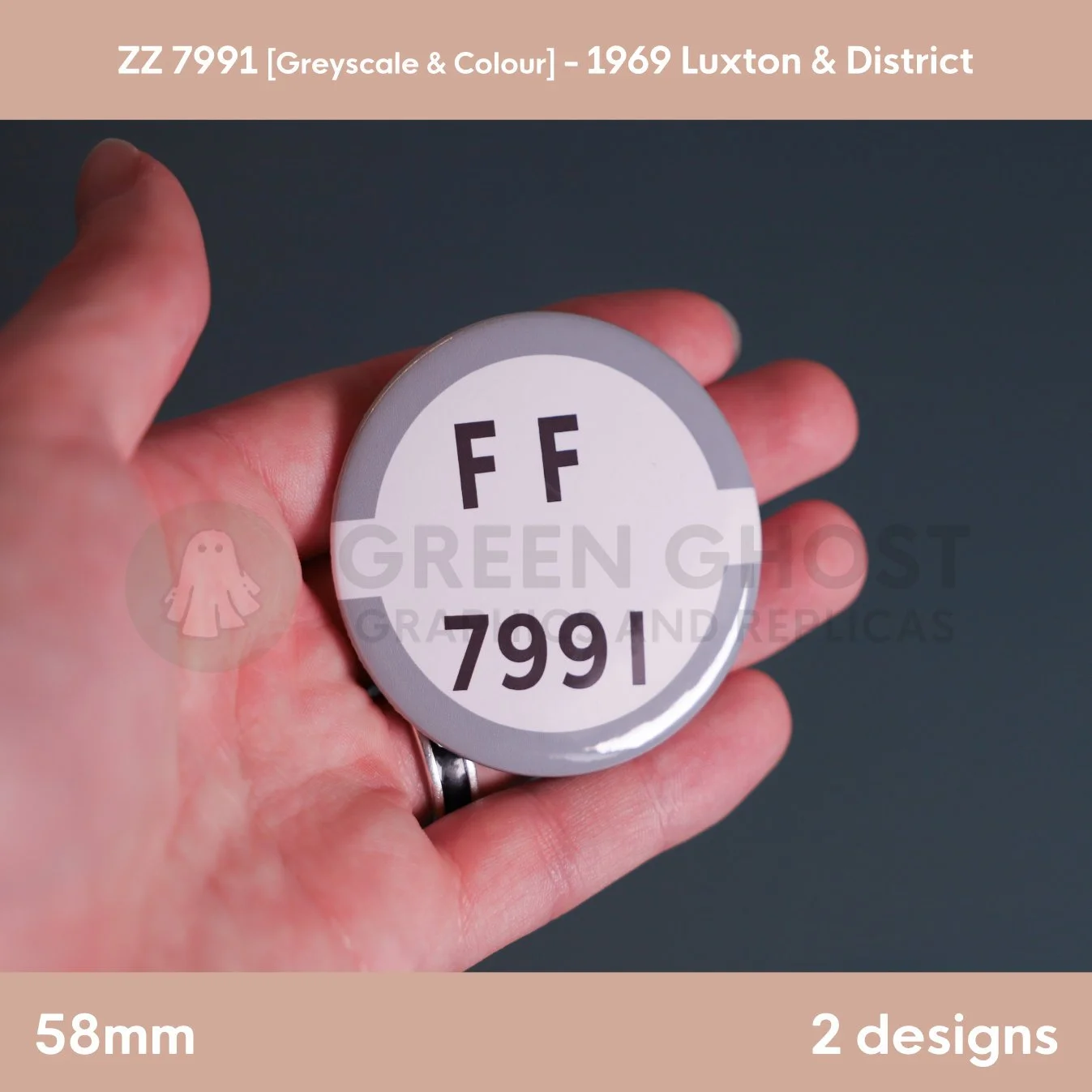 A round white badge with a grey border and the text “FF 7991” held in a hand against a muted background.