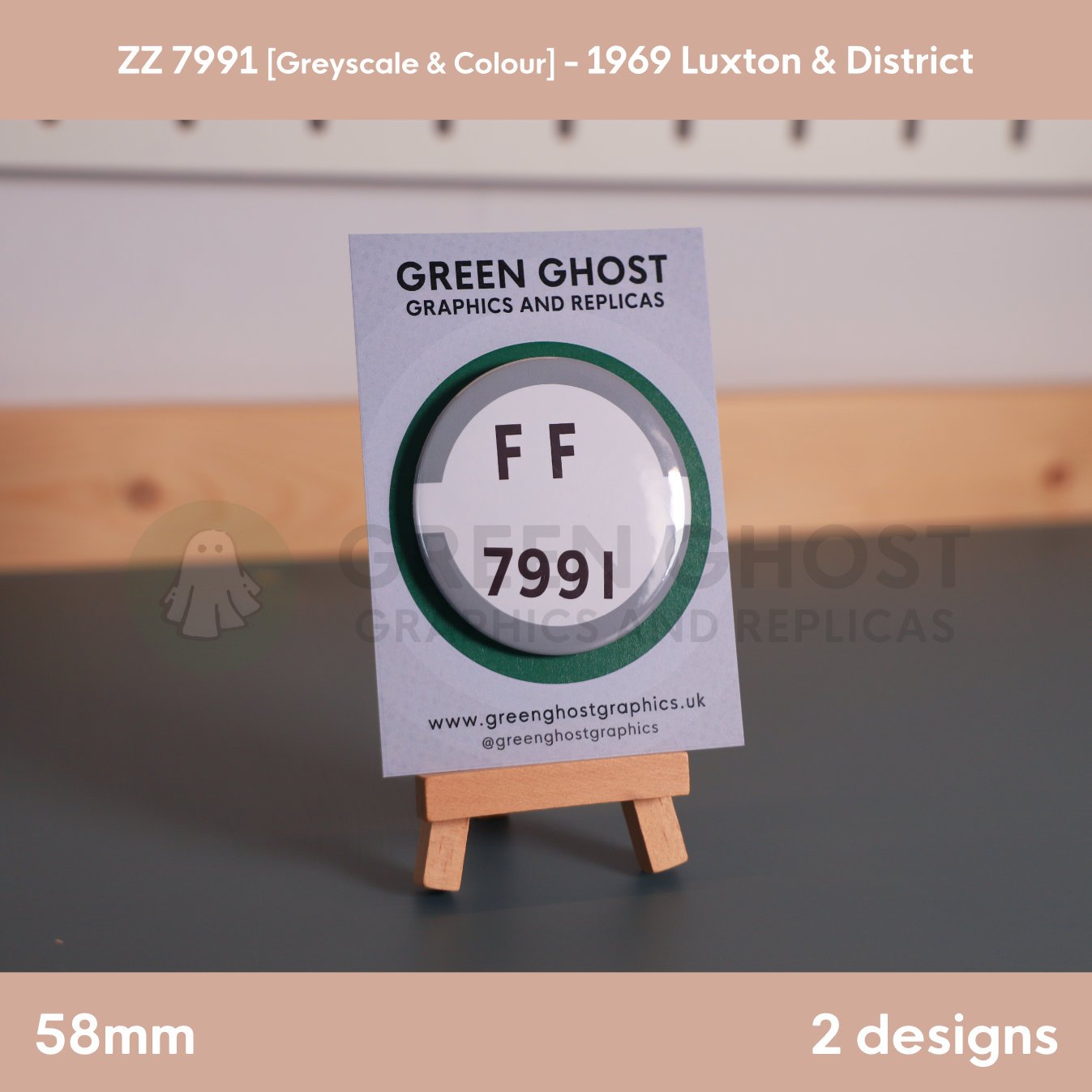 A round white badge with a grey border and the text “FF 7991” shown on a branded backing card on a wooden easel.