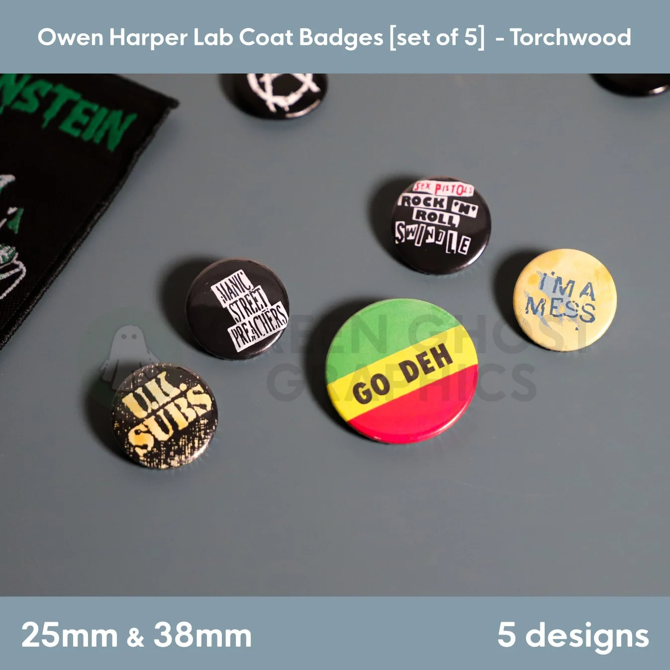 A round red, yellow, and green “GO DEH” badge mounted on a Green Ghost Graphics display card with four matching music‑themed badges shown alongside it.