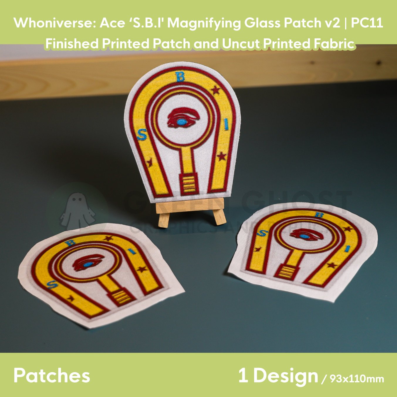 Printed patch design, finished with interfacing and glued edges. Horse shoe and magnifying glass design in red, with blue and red text and detailing and full yellow background.
