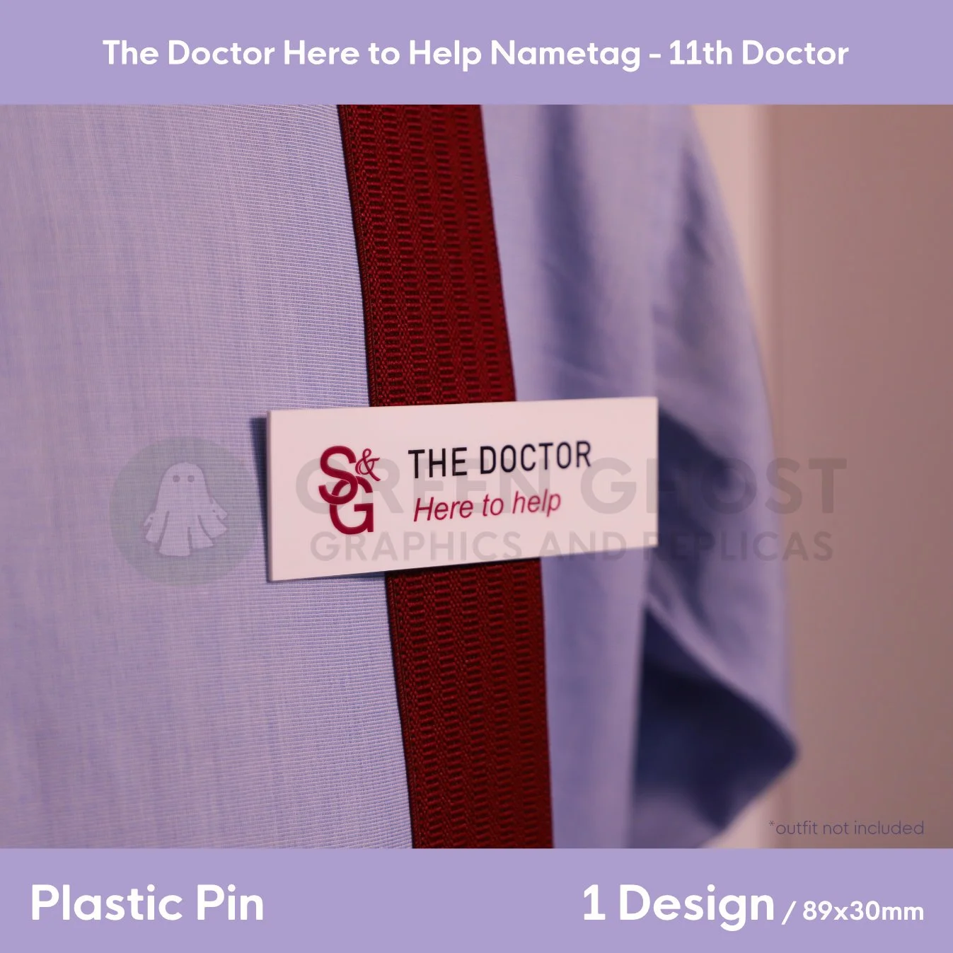 A white rectangular nametag with black and red “S&G THE DOCTOR Here to help” text clipped to a blue shirt and dark red tie.