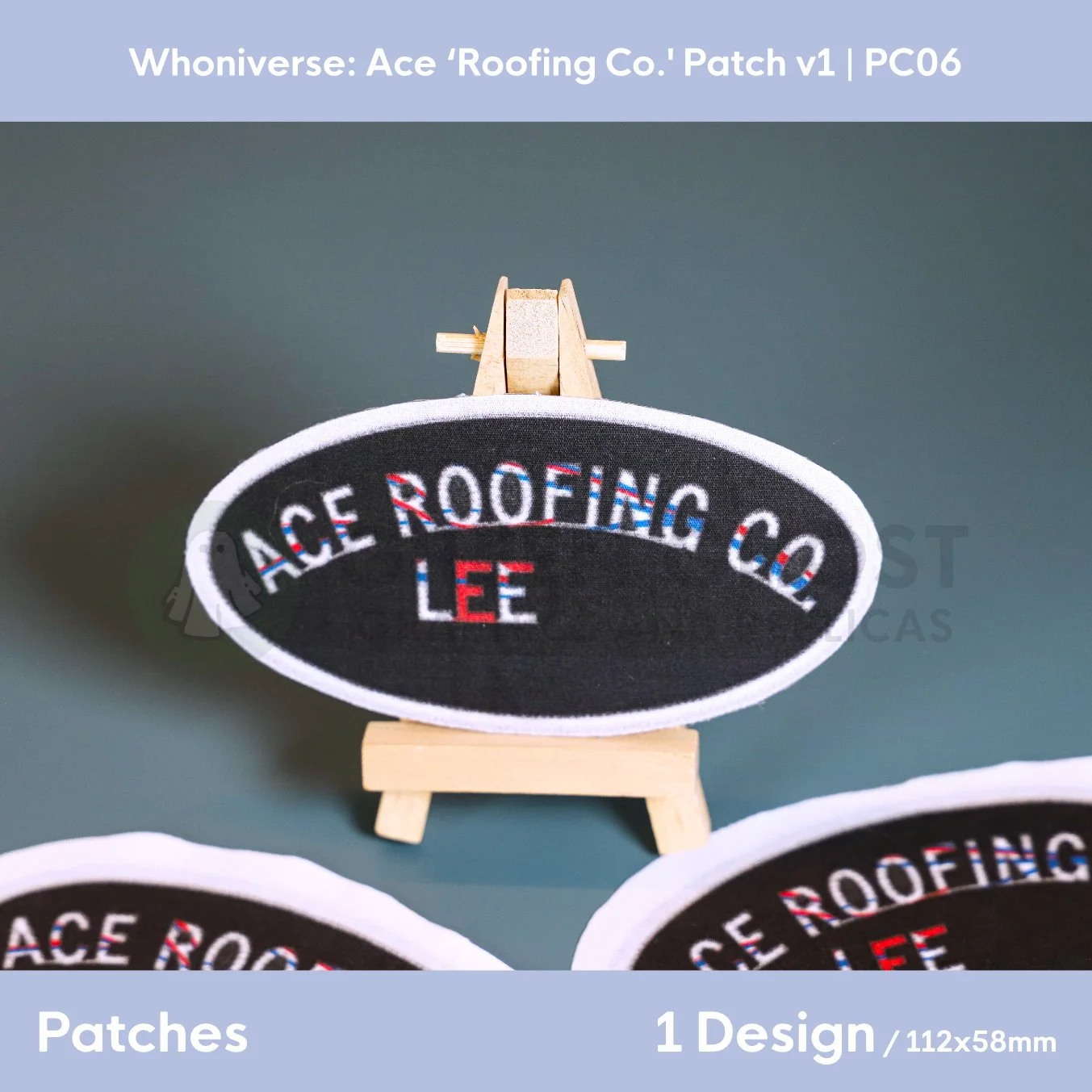 Close up of the finish Roofing Co. oval patch on a small easel surrounded by further finished versions on a aqua green background.