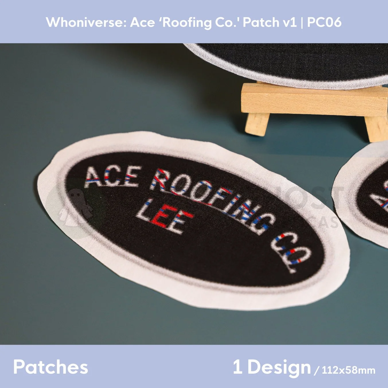 Close up of the uncut unfinished version of the Ace Roofing patch design, on a plain aqua green background.