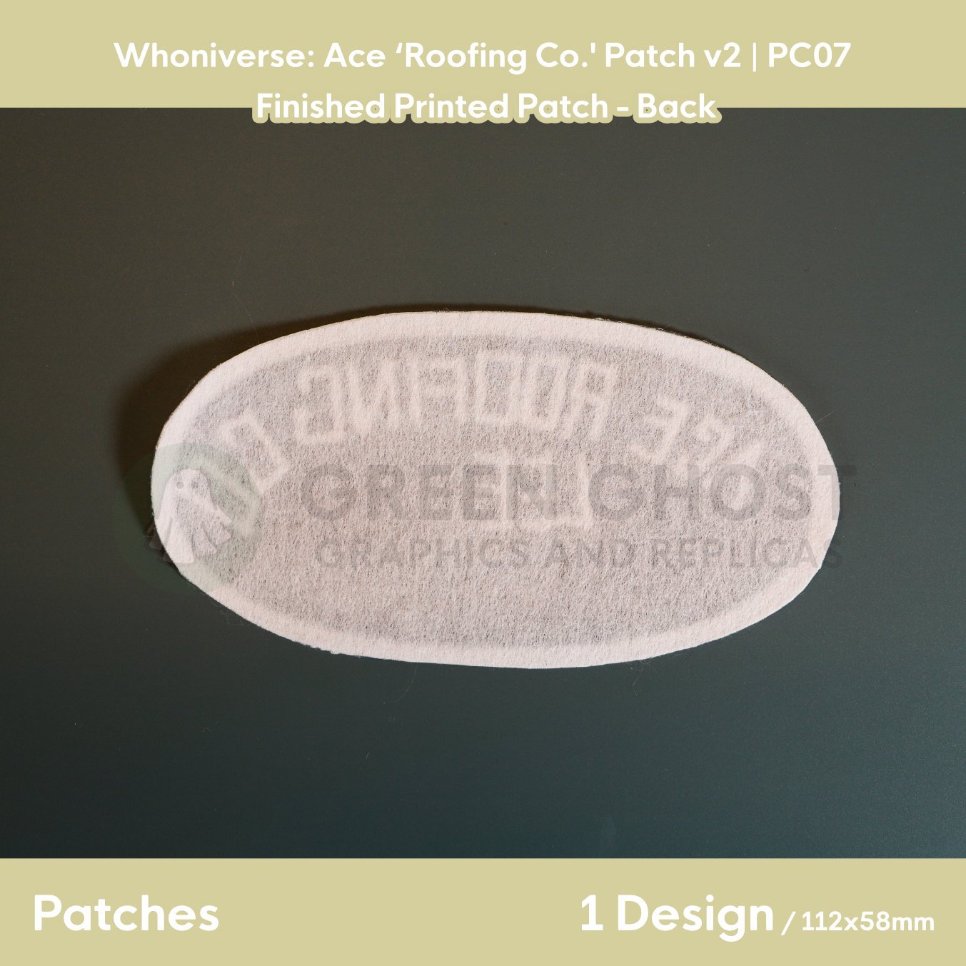 Finished version of the Roofing Co. patch laid flat on a table showing the interfaced backing.