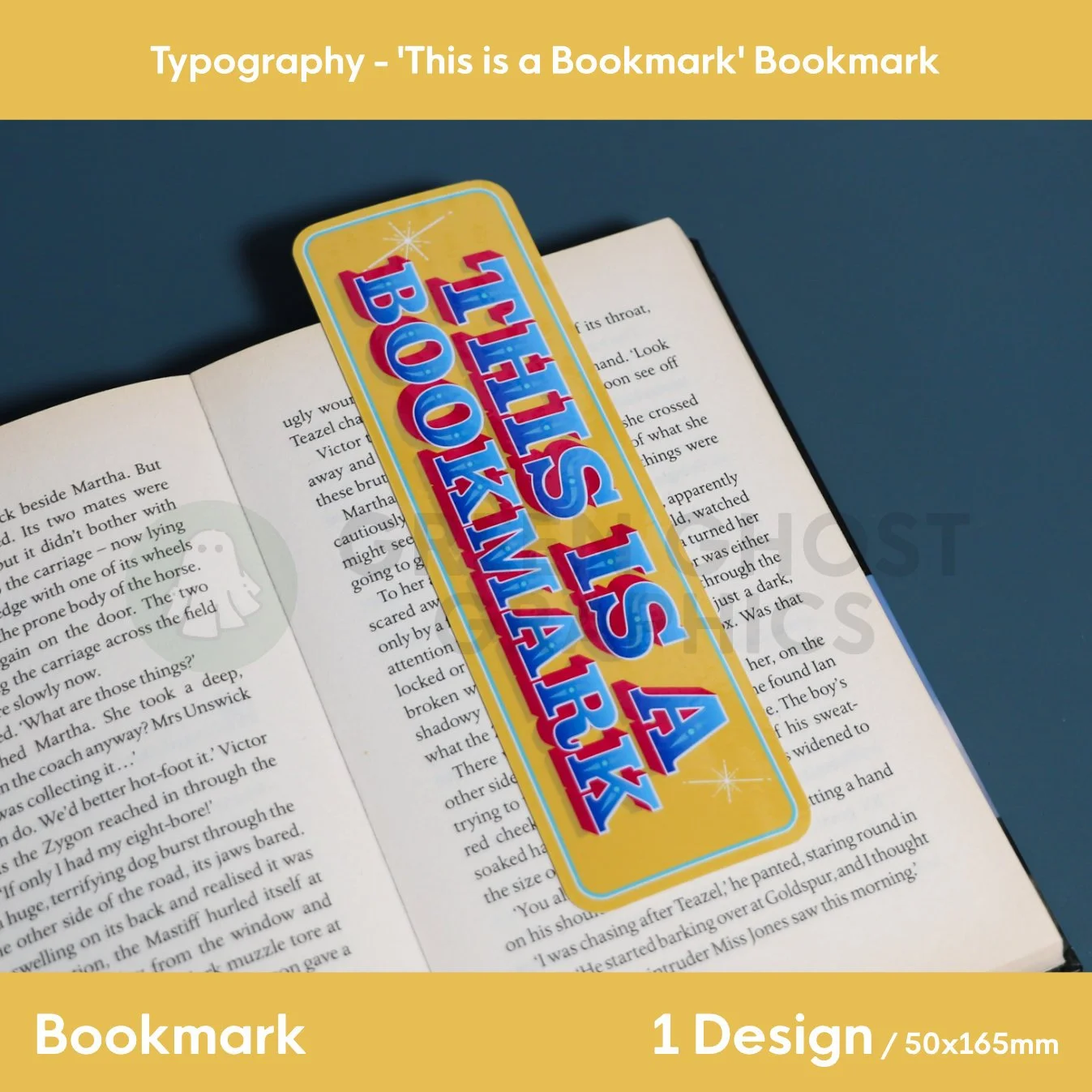 A yellow bookmark with rounded corners and bold multicolour “THIS IS A BOOKMARK” text placed flat over an open book.