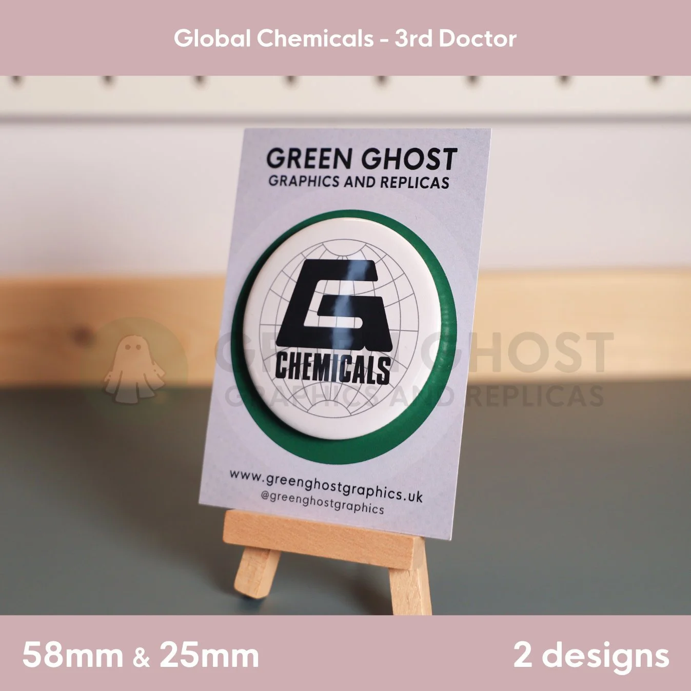 A round white badge and the “G CHEMICALS” logo mounted on a branded backing card on a wooden easel.