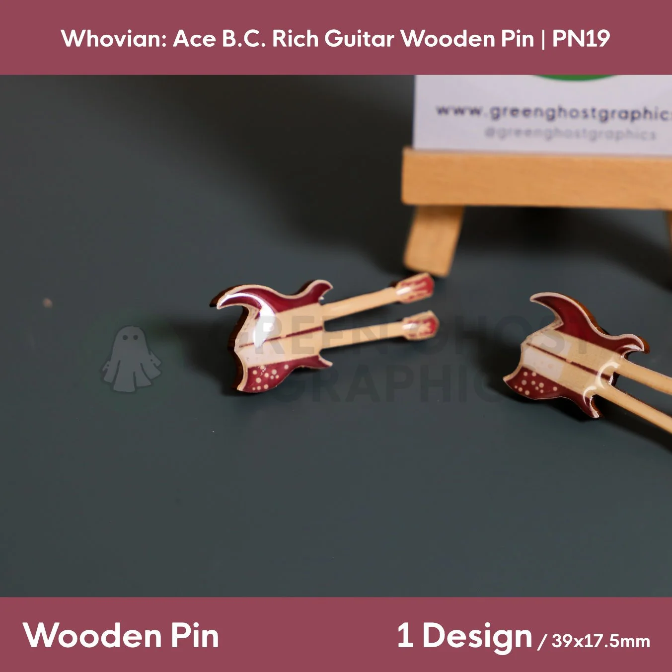 Two double‑neck guitar wooden pins in dark brown and cream colours positioned on a flat surface beside a small wooden easel.