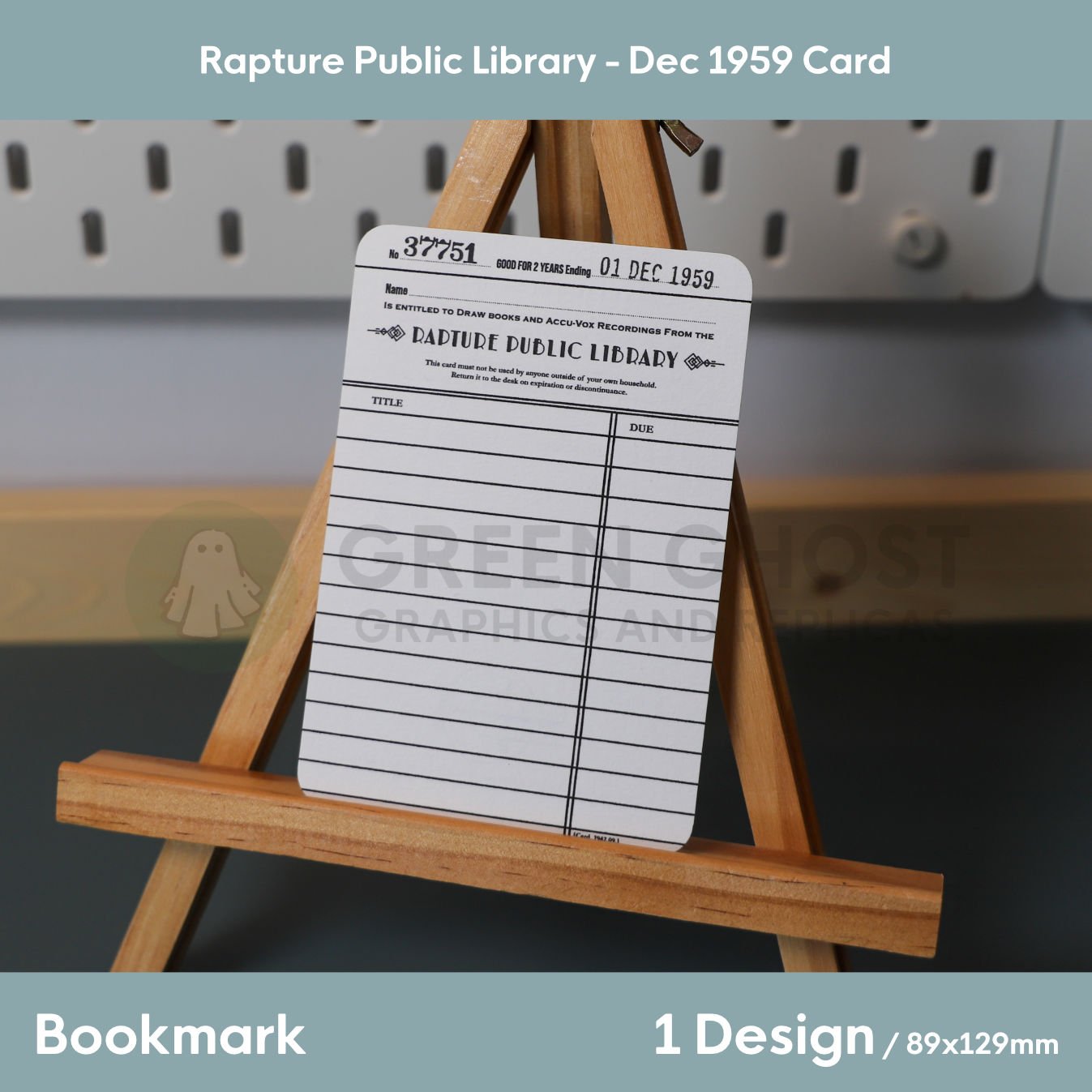 A vintage‑style Rapture Public Library card displayed on a wooden easel, featuring blank spaces for name, book titles, and due dates in a 1950s design.