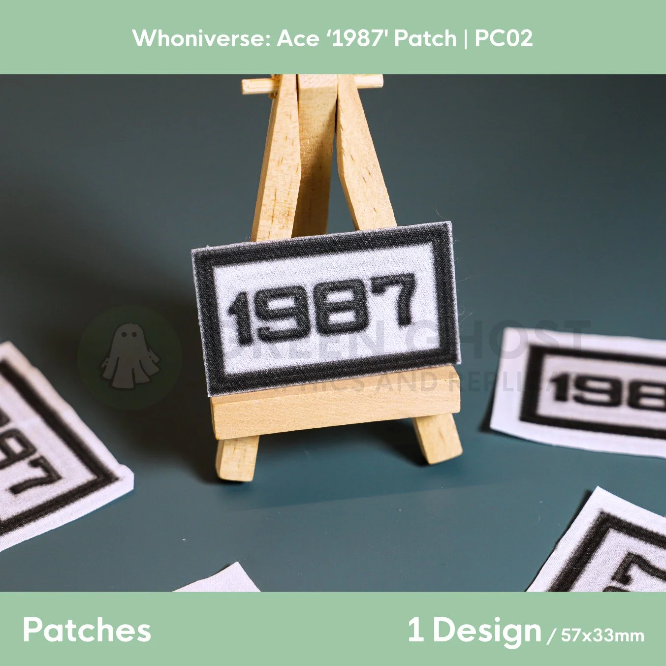 Close up of the finish patch on a small easel surrounded by uncut versions on a aqua green background.