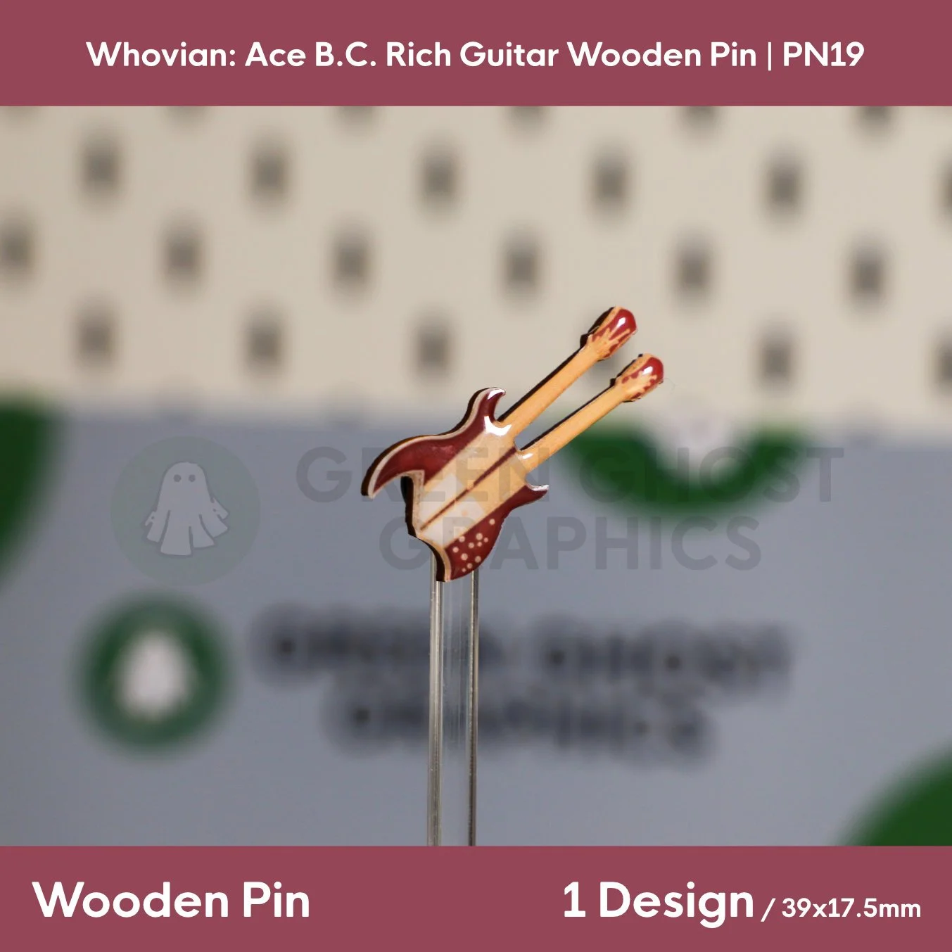 A double‑neck guitar‑shaped wooden pin in brown and cream tones displayed upright on a transparent display rod.